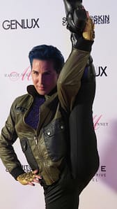 Vocalist Ricky Rebel kicks up his leg in honor of Dita's cover. Check out his bejeweled golden gloves from designer Rayson Mark