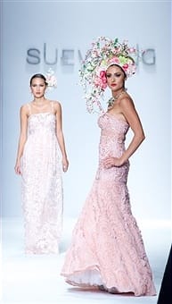 Cleary and another model in their stunning gowns and beautiful floral headdresses. Photo courtesy of Earl Gibson III/Wireimage