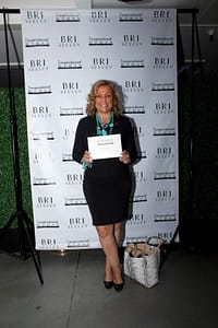 Author and consultant Wendy Dean poses with her copy of the book