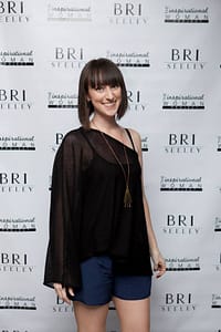 Bri takes a break from all her design and charitable endeavors to smile for the camera.