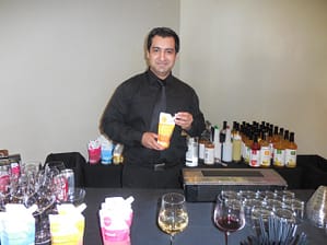Bartender Juan Carlos pours some amazing Nuvino wine for attendees