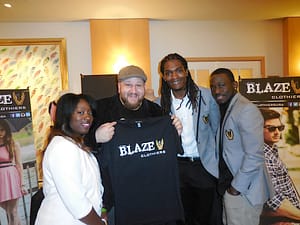 Actor Stephen Kramer Glickman with the founders of Blaze Clothing