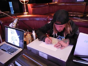 Adam Daniel creatively thinks of his next tattoo design. Photo courtesy of Vida G.