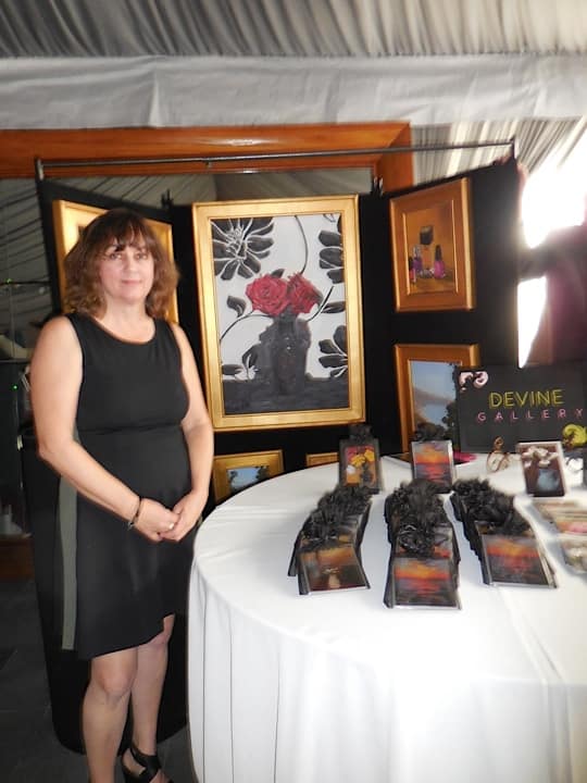 Susan Devine of Devine Gallery with her beautiful artwork