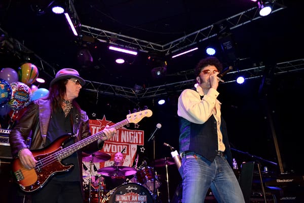 Paulie Z and Chuck Wright singing An American Band photo courtesy of Judy Hansen Pullos