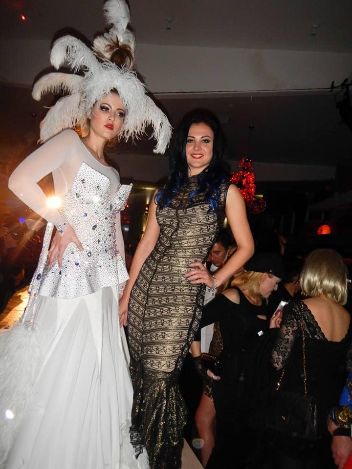 Pretty model in a white gown with designer Kalina. Photo courtesy of Gennadiy Kotyarchuk Photography