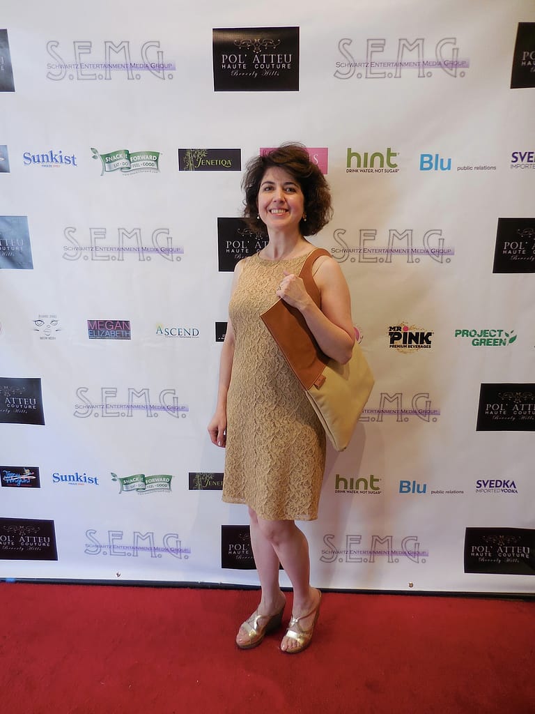 Julia Wasah of her self-titled, stylish handbag line looks elegant on the red carpet